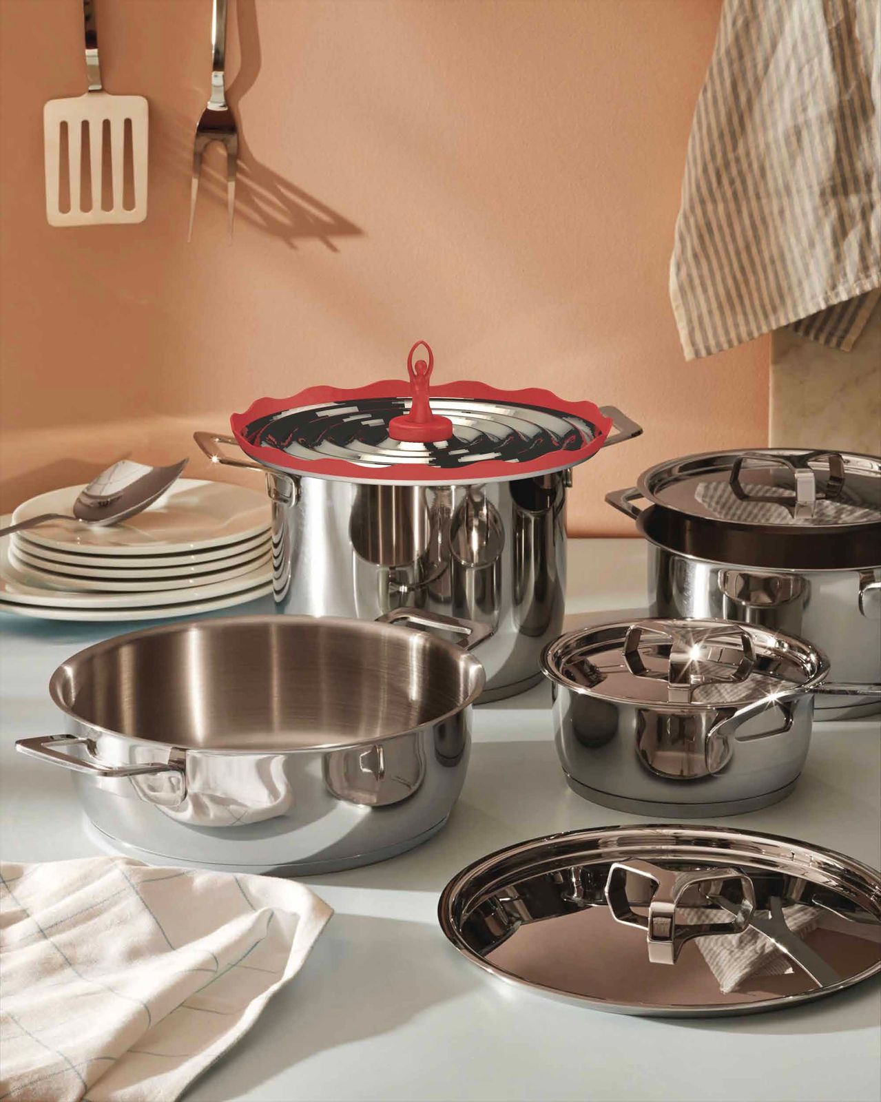 Vaporina in an Alessi pot among steel cookware